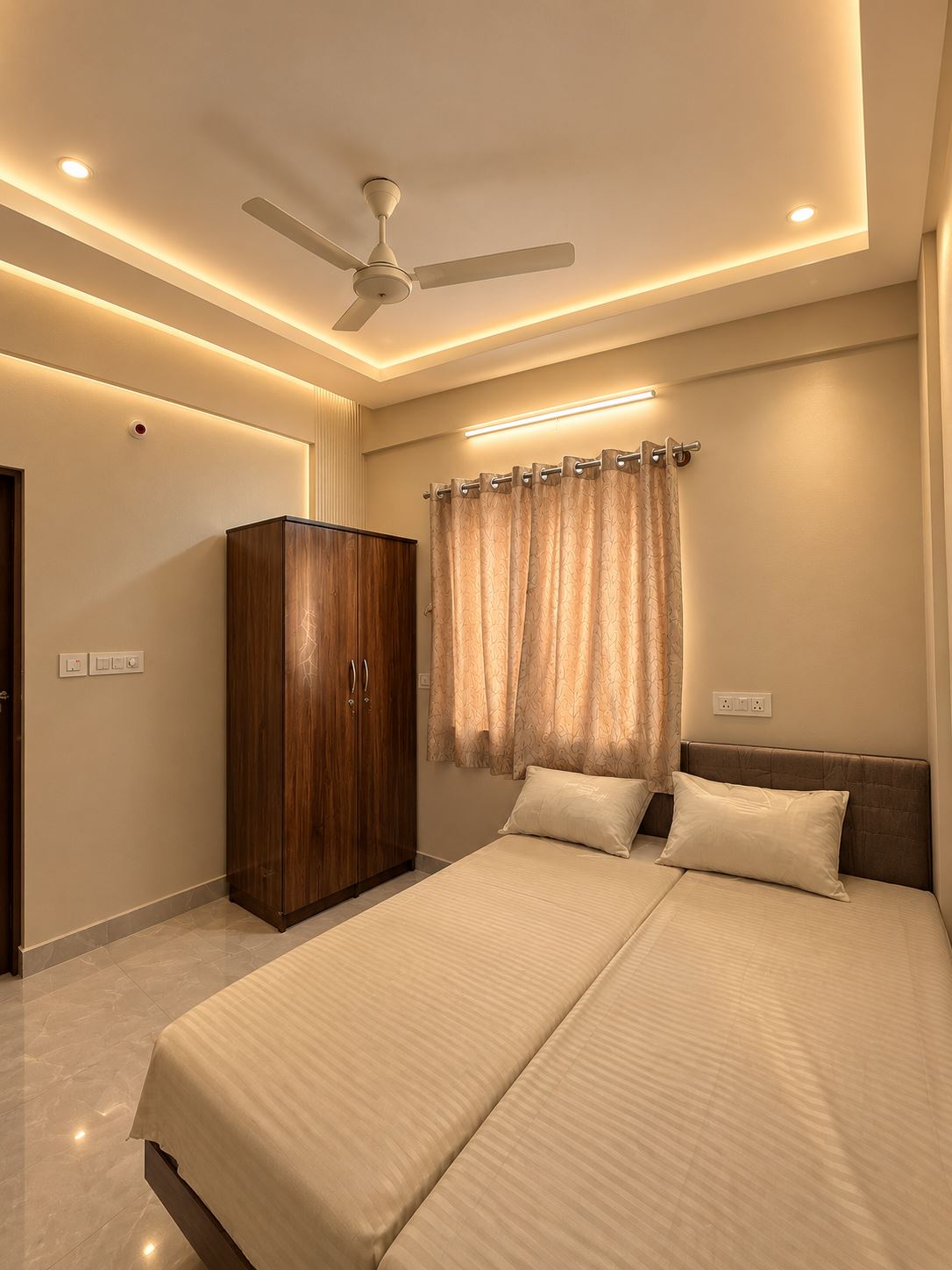 Double-sharing bedroom at Niva Colive PG